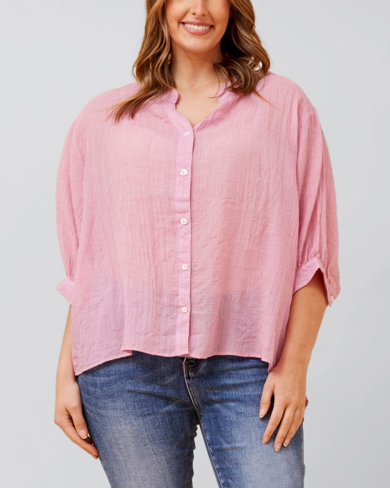 Front of a model wearing a size 1X Roxanne Oversized Semi-Sheer Shirt Blouse Solid in Pink by ANNICK. | dia_product_style_image_id:352509